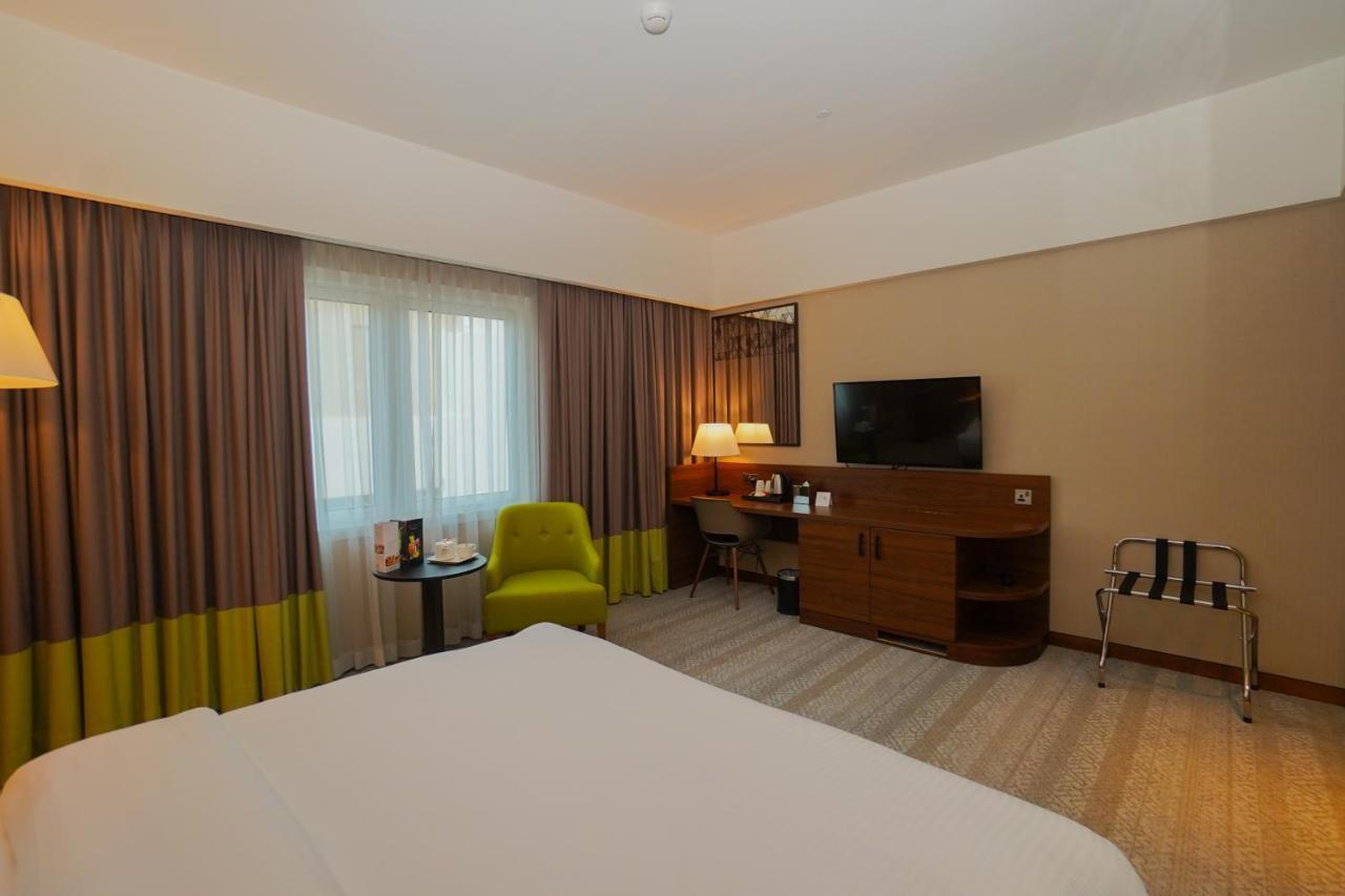 The Grand Lux Hotel Doha Exterior foto A room at the hotel
