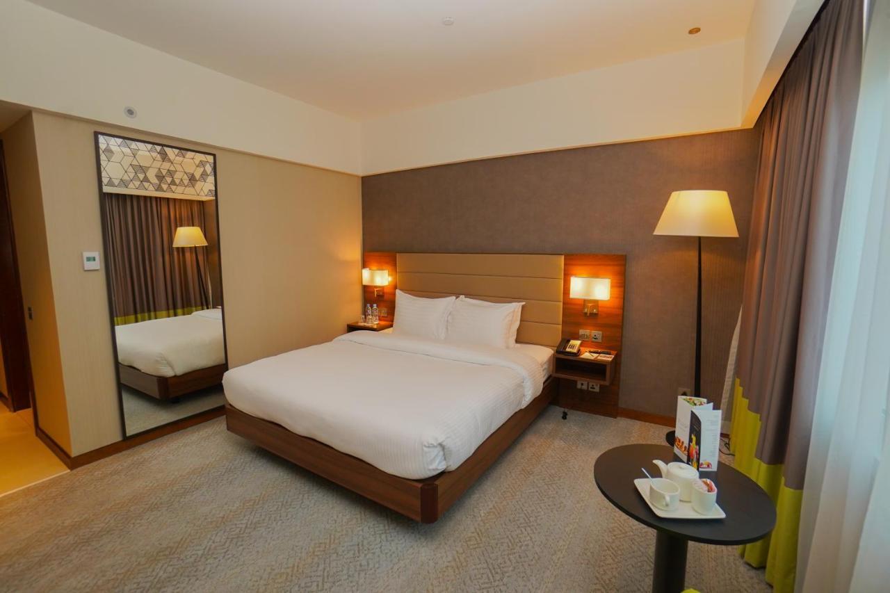 The Grand Lux Hotel Doha Exterior foto A room at the hotel
