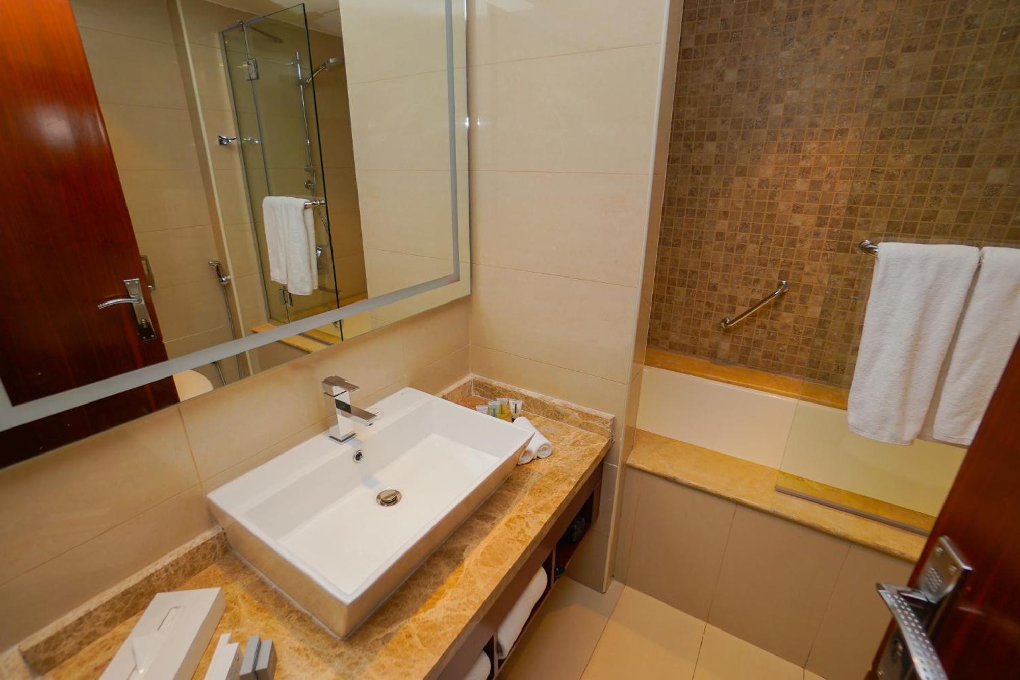 The Grand Lux Hotel Doha Exterior foto Bathroom